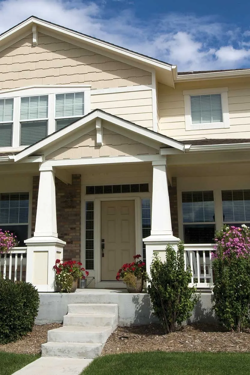 A craftsman installing a new exterior door