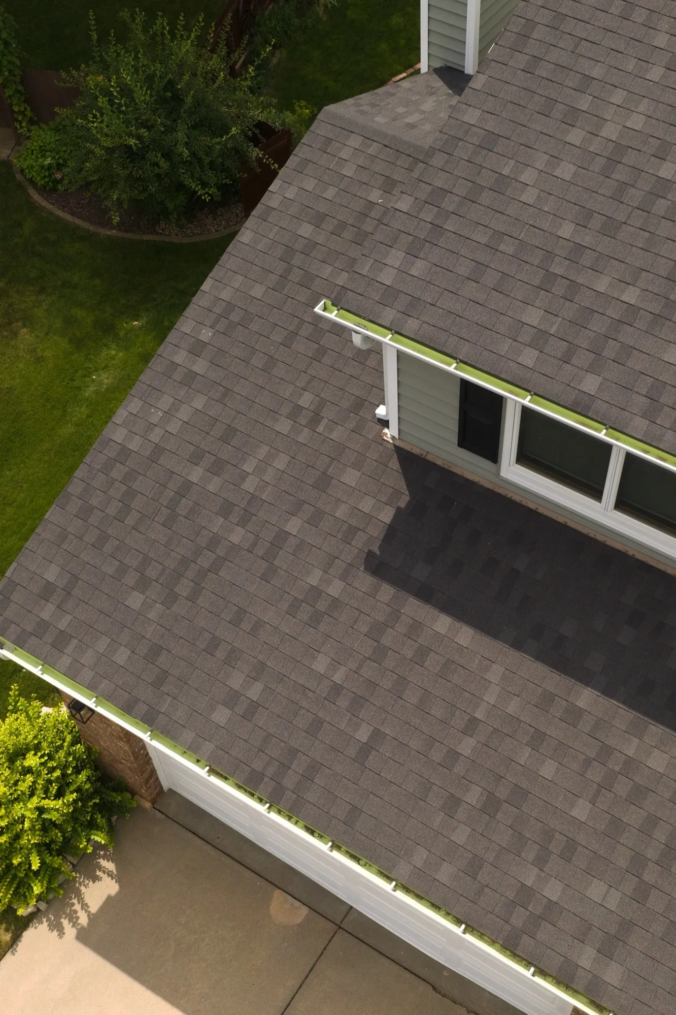 Architectural shingles being installed on a roof deck