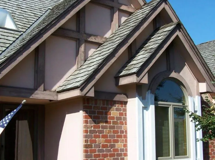 Two-story home re-sided in tan lap siding — before