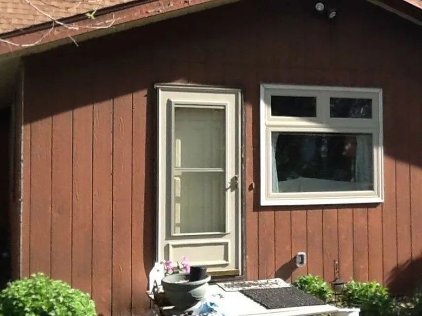 Entry wall re-clad in stone veneer siding — before