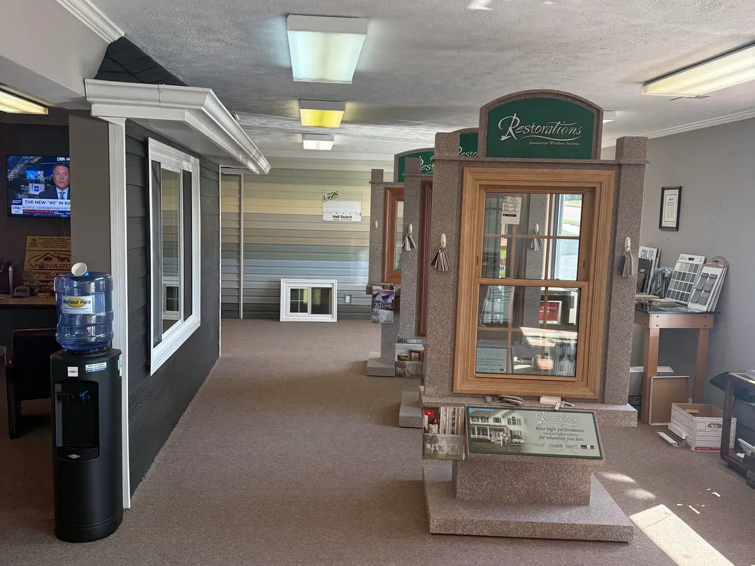 Restorations window displays along the Monarch showroom aisle