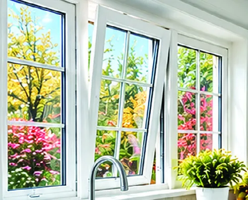 Kitchen windows open over the sink, with fall trees outside