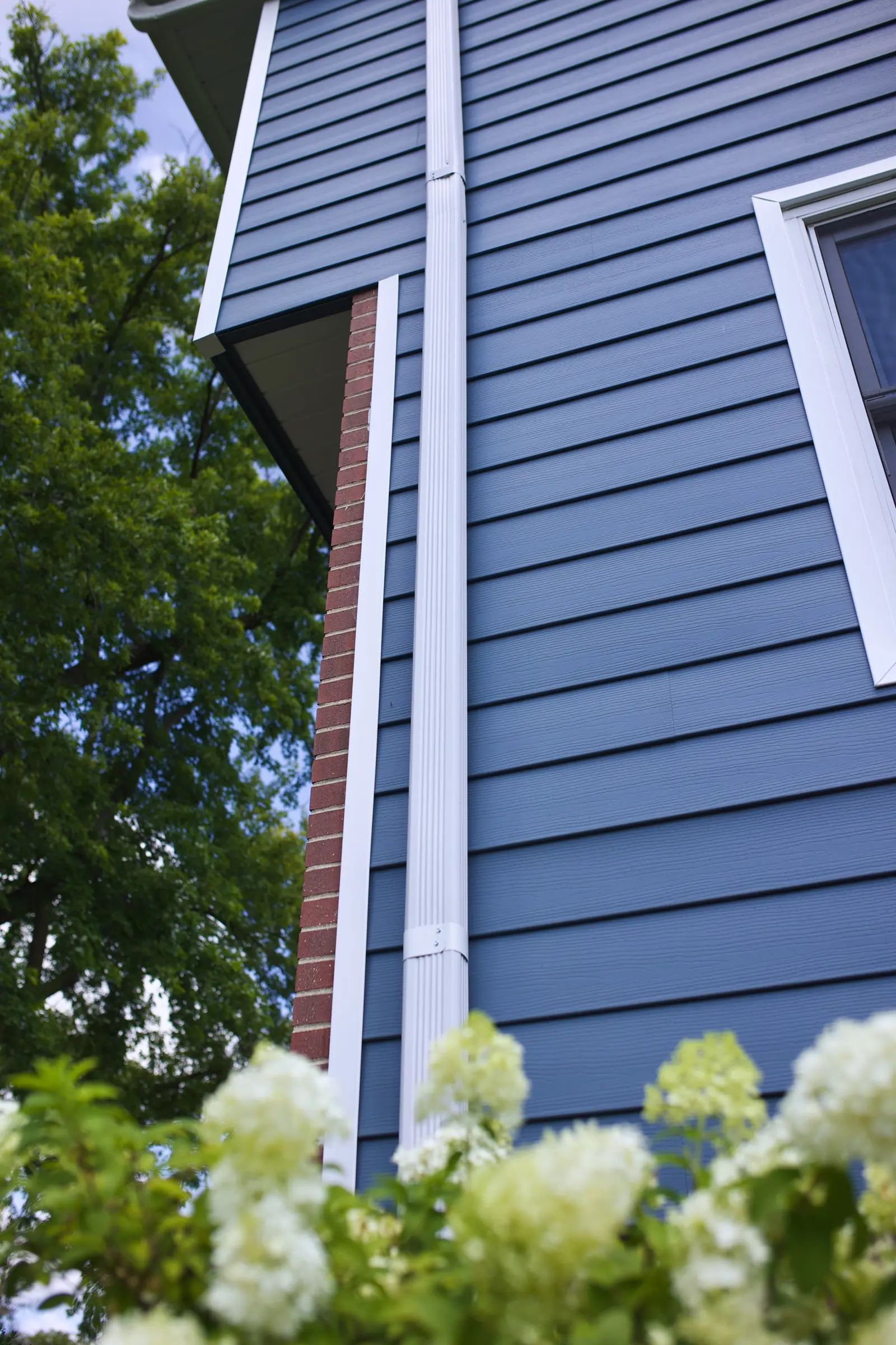 Two-story home finished in blue lap siding