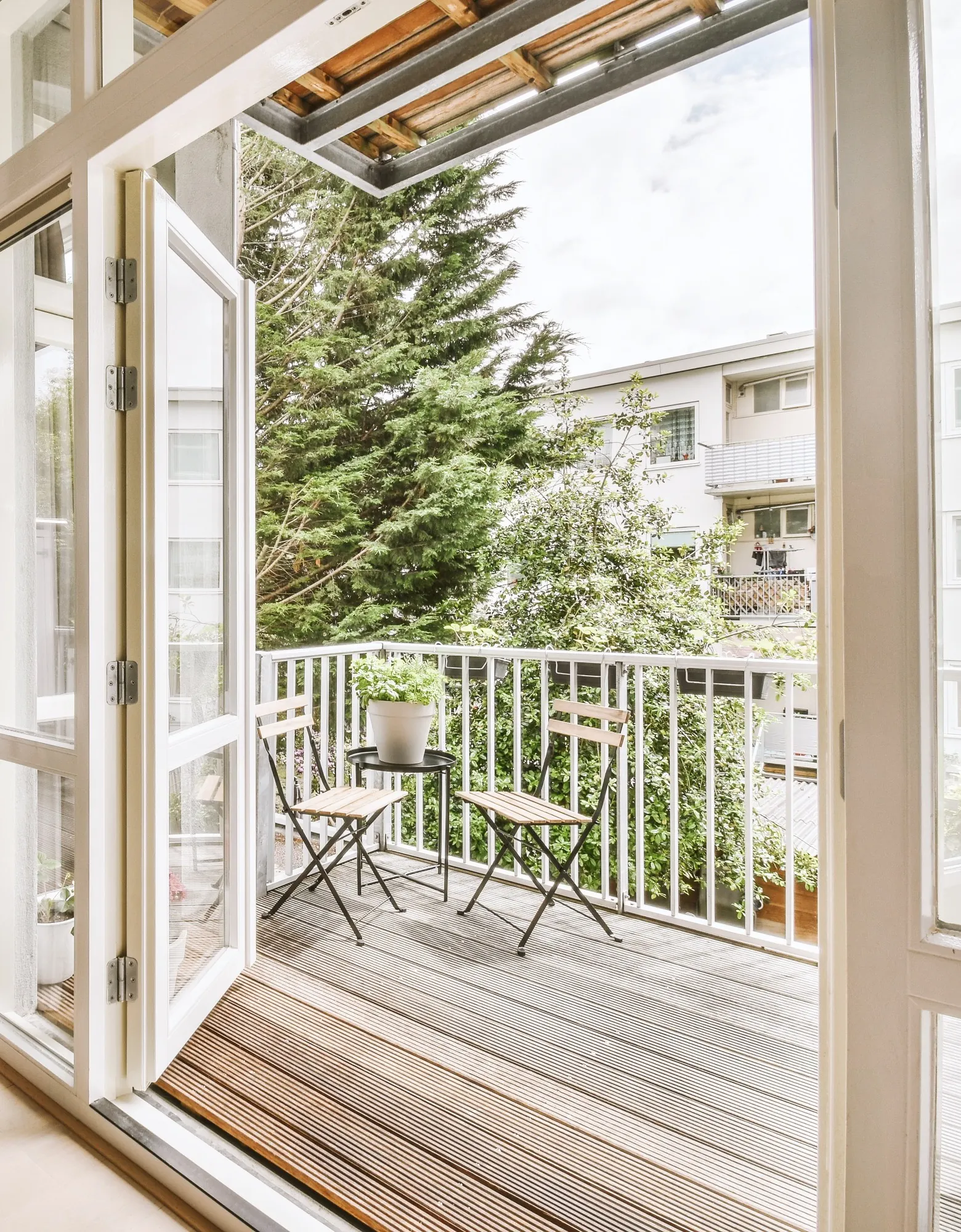 Open French patio doors leading out to a deck