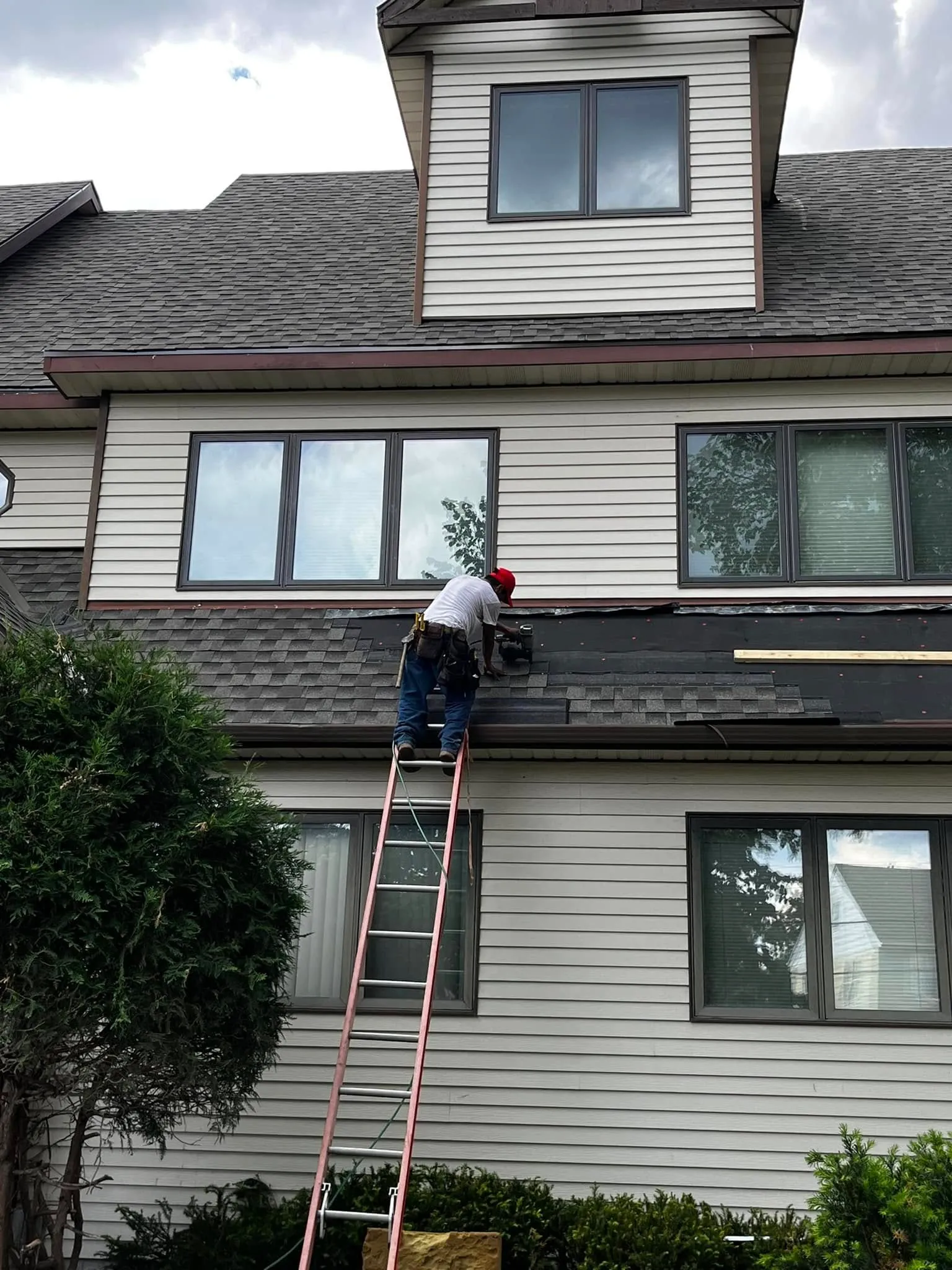 Pre-formed metal roofing in a slate-style profile on a home