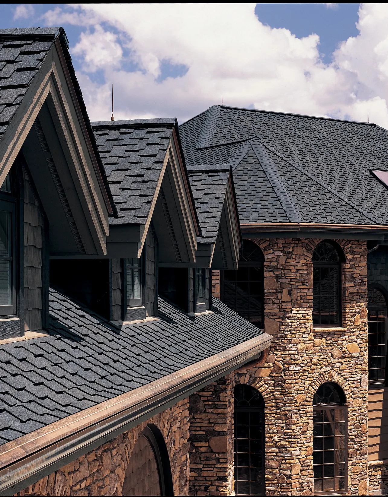 CertainTeed Presidential shingles on a stone home with dormers