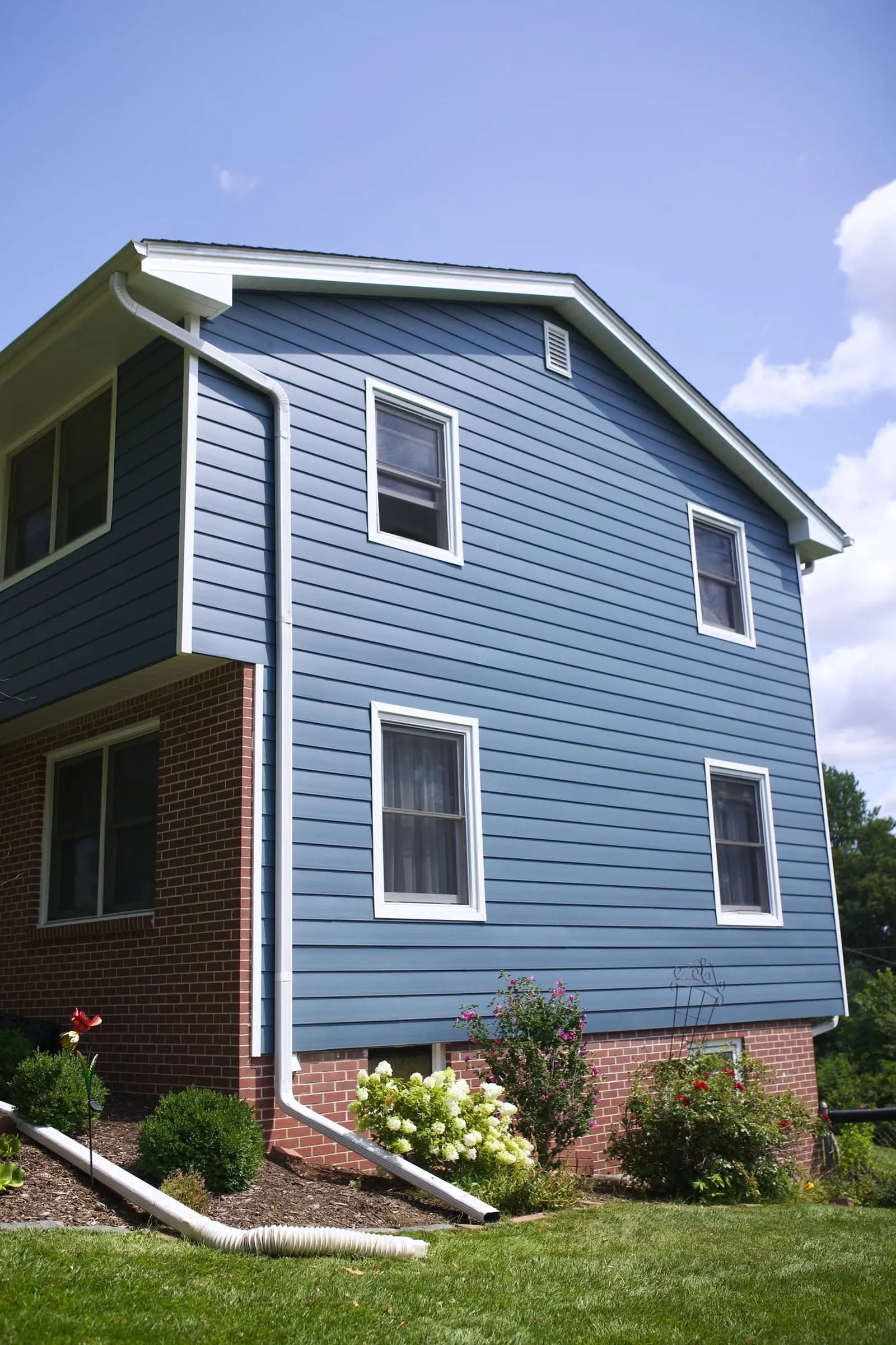 Two-story home finished in blue lap siding